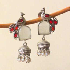Elevate your ethnic look with antique silver peacock jhumka earrings.